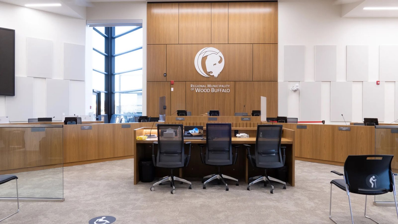 Acoustic wall panels in public assembly space