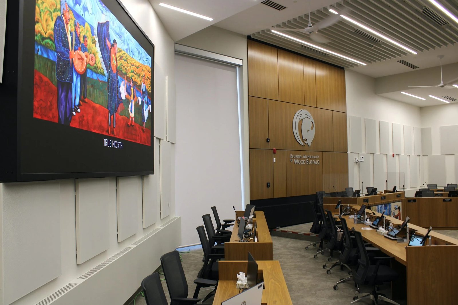 Institutional acoustic panels around presentation display